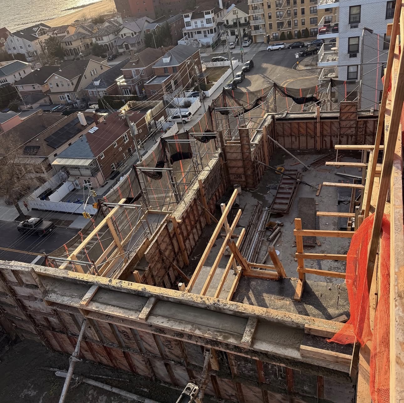 Active rear addition framing showing the structural connection between an existing NYC building and new wood-framed construction